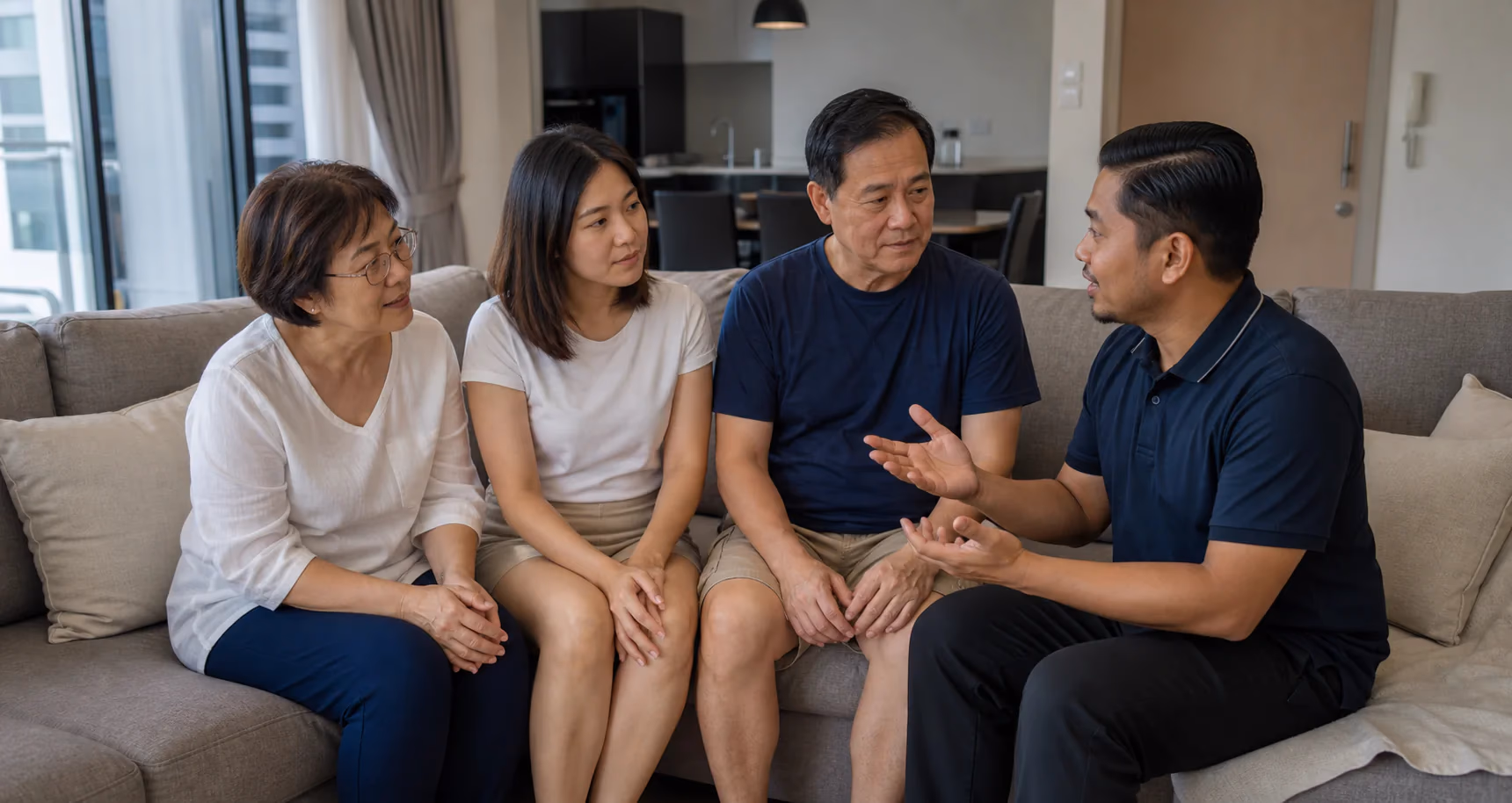 A Chinese Malaysian family discussing suitable home care with a therapist
