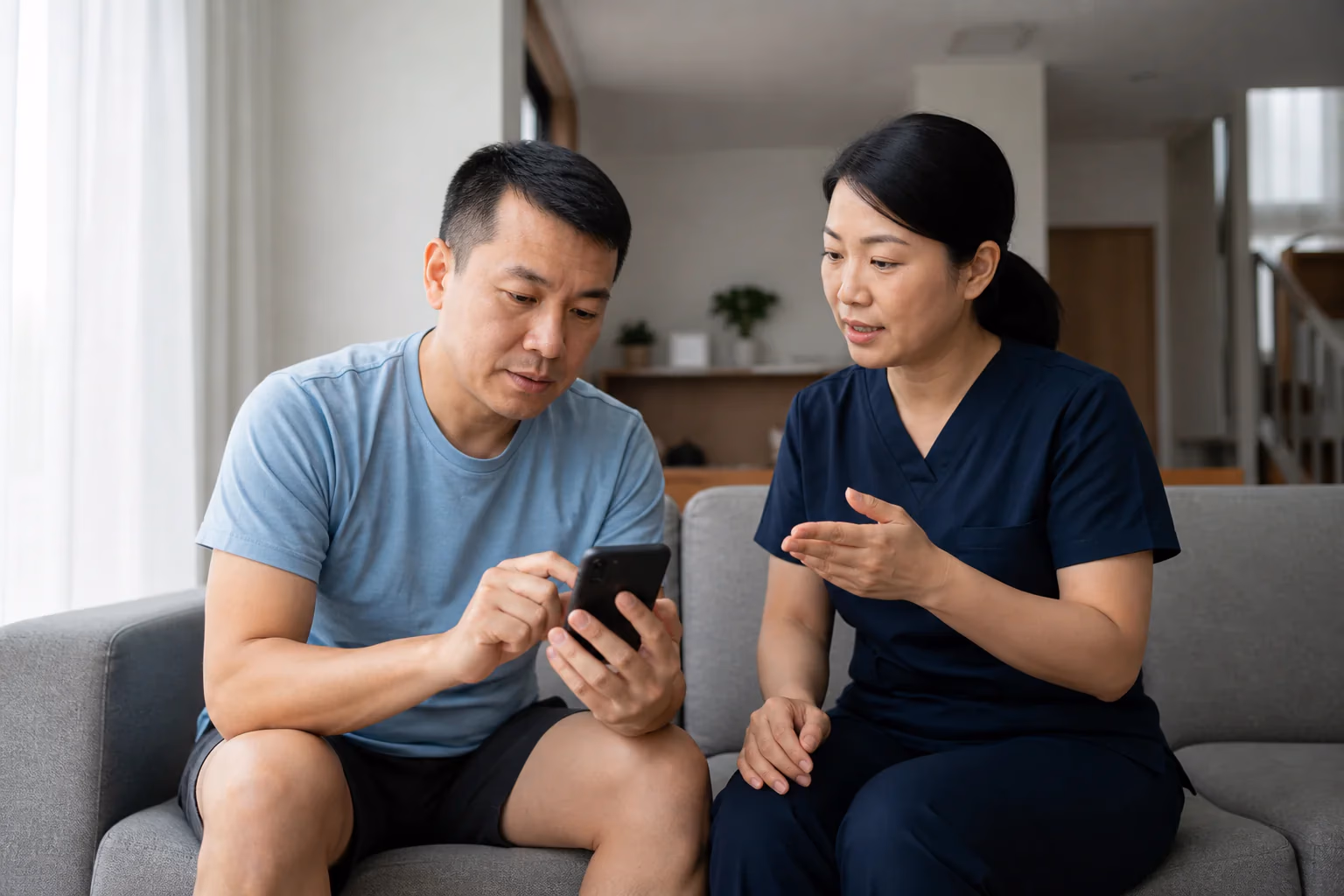 A Chinese Malaysian client using a phone-based massage suitability tool